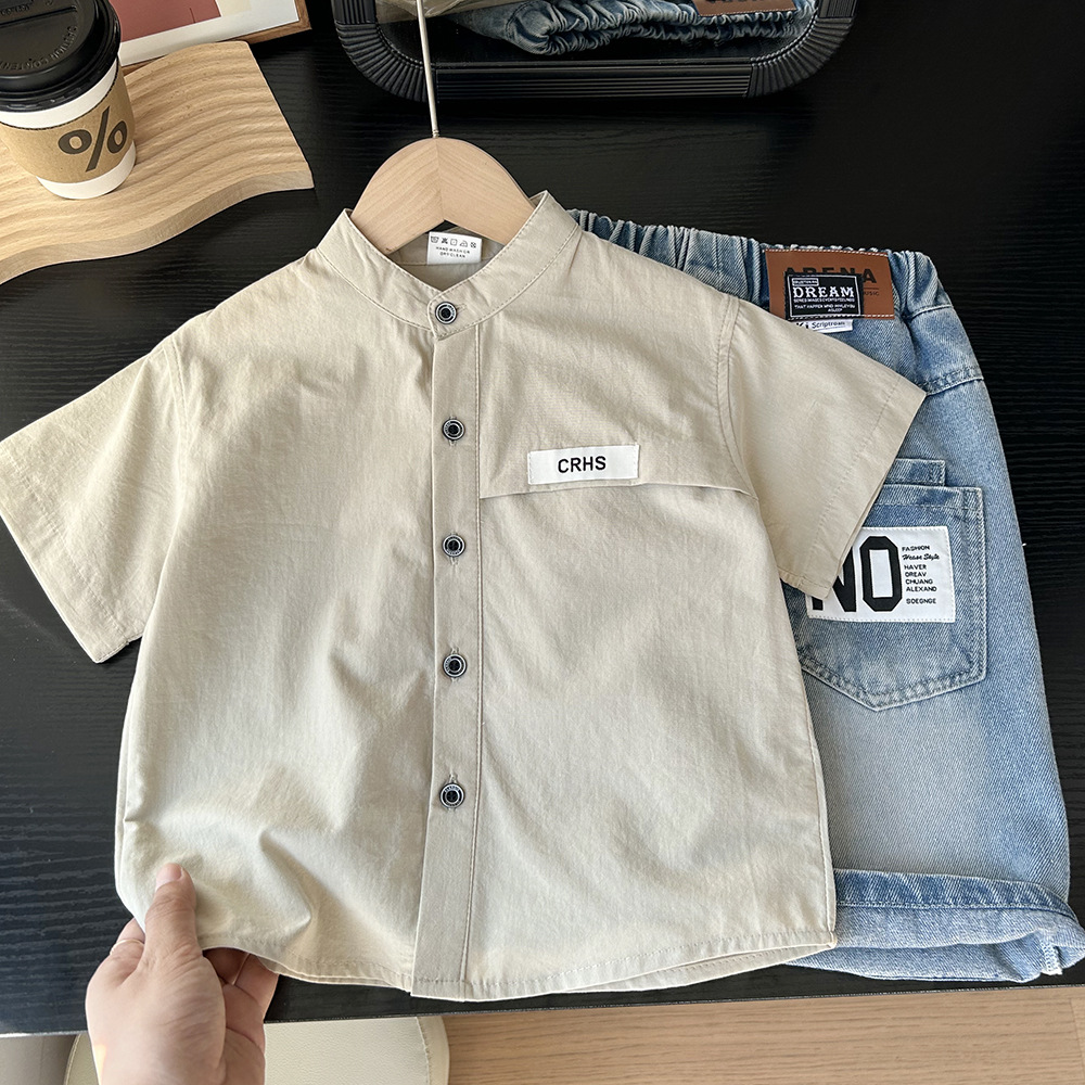 Cream Shirt with Black Button Detail